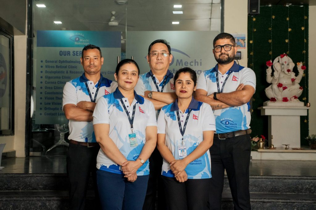 Mechi Netralaya staff team standing in front of the clinic