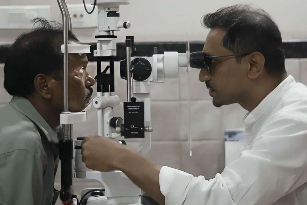 Eye doctor examining patient's eyes with a phoropter