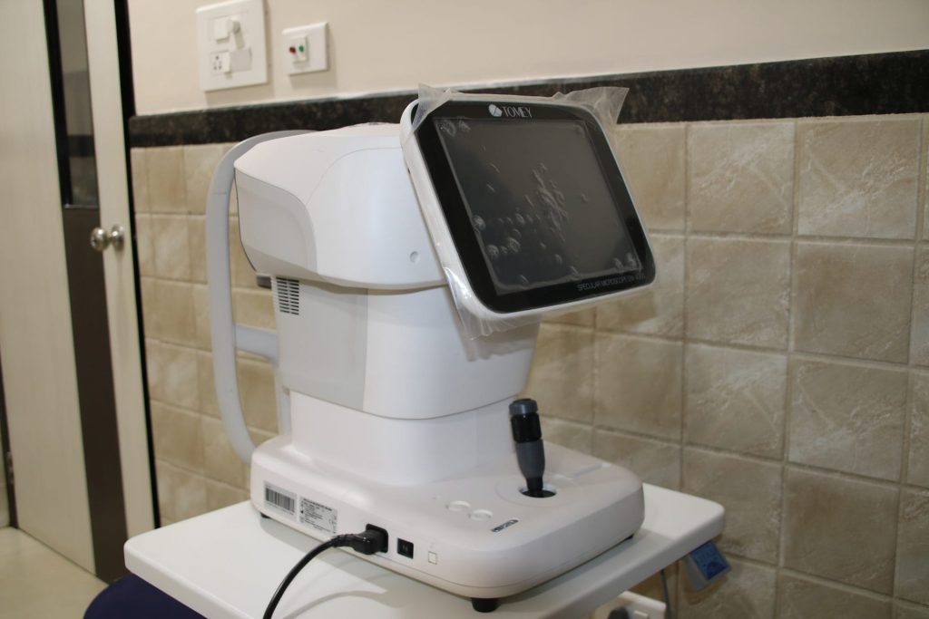 ophthalmic equipment with screen and controls on a table
