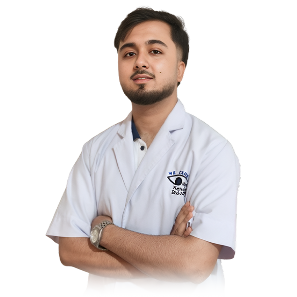 Young doctor in white coat with arms crossed looking up